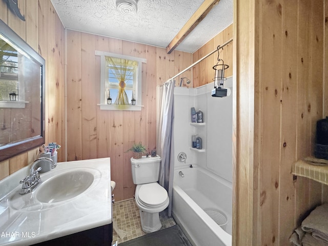 full bathroom featuring wood walls, a textured ceiling, toilet, shower / tub combo with curtain, and vanity