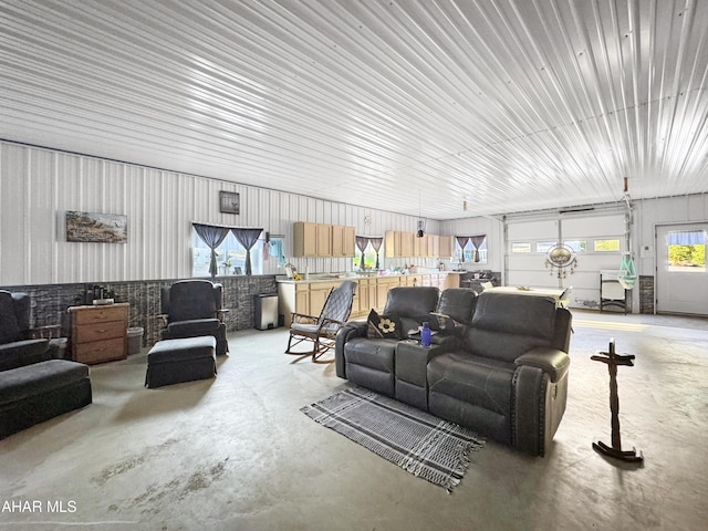 living room featuring concrete flooring