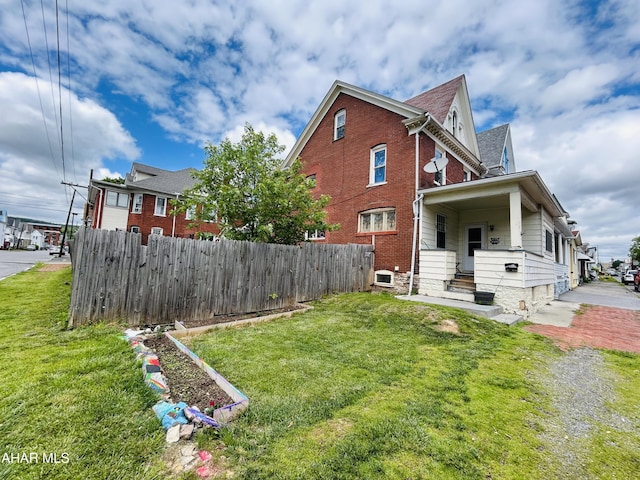 view of side of property with brick siding
