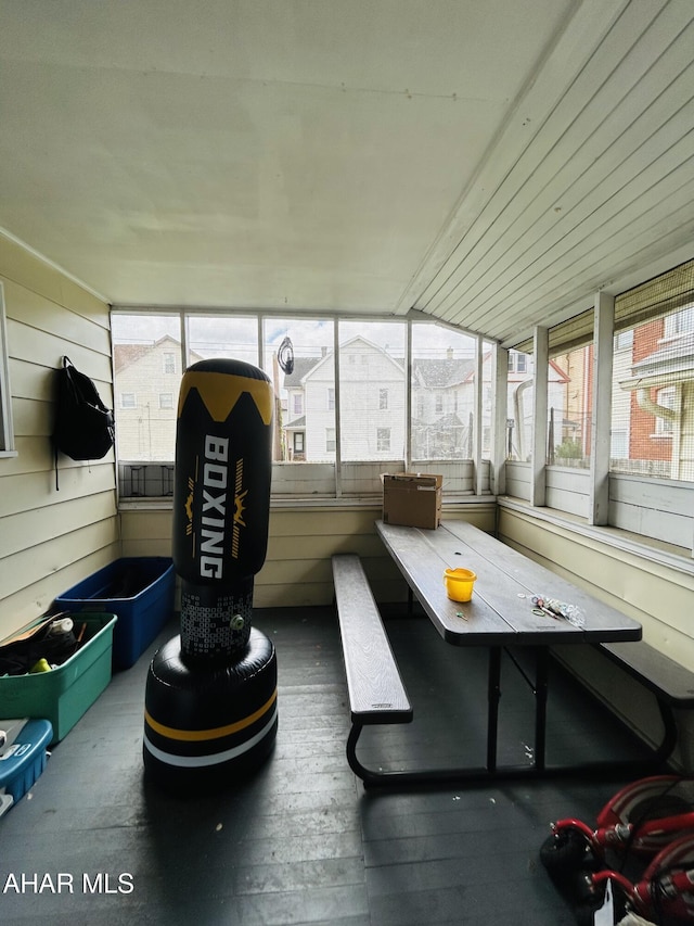 sunroom / solarium with outdoor dining space