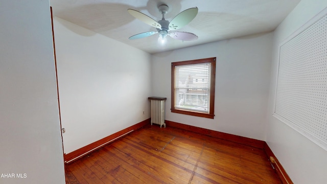 2822 5th Ave, Altoona, PA 16602 - spare room featuring radiator, hardwood / wood-style flooring, baseboards, and a ceiling fan