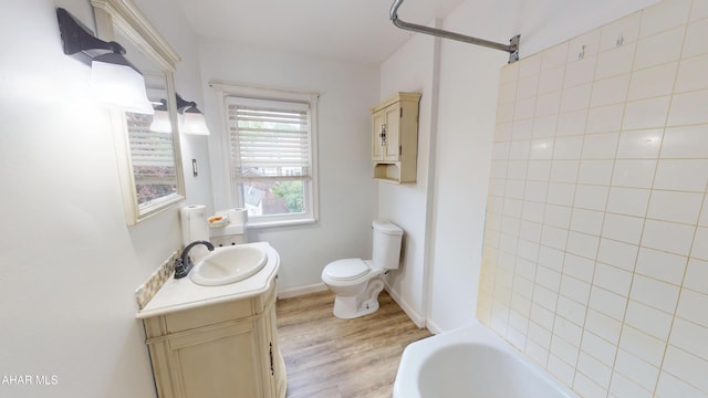 2822 5th Ave, Altoona, PA 16602 - full bath featuring vanity, wood finished floors, toilet, and shower / bath combination