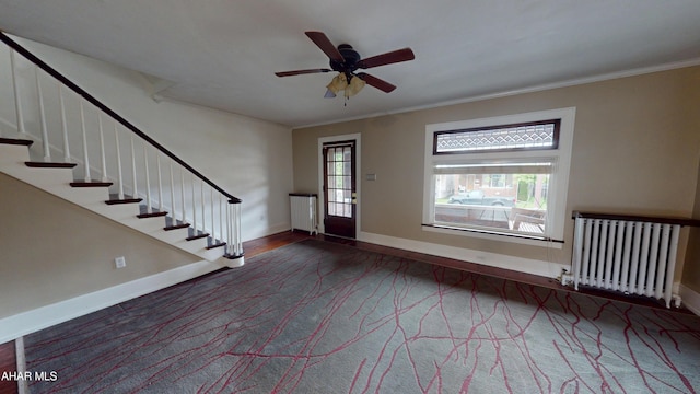 2822 5th Ave, Altoona, PA 16602 - entrance foyer featuring radiator heating unit, stairway, a ceiling fan, ornamental molding, and baseboards
