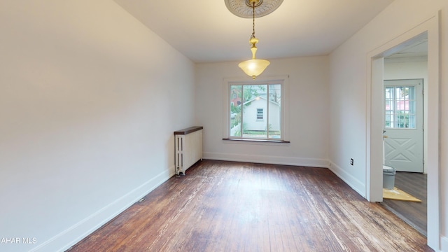 2822 5th Ave, Altoona, PA 16602 - unfurnished dining area with plenty of natural light, wood finished floors, and baseboards