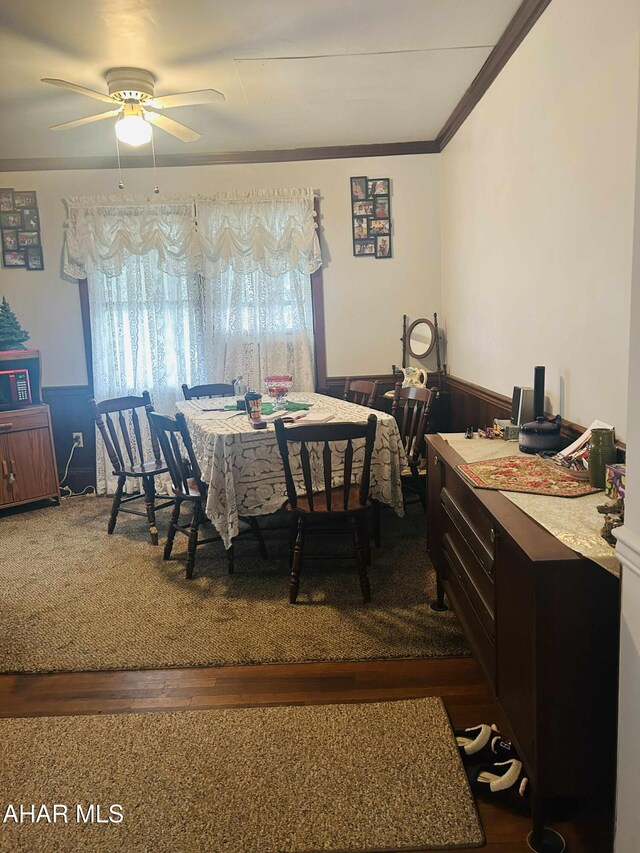 14 W 2nd St, Everett, PA 15537 - dining space with ceiling fan, ornamental molding, dark wood-style floors, and wainscoting