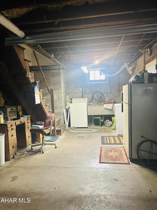 14 W 2nd St, Everett, PA 15537 - basement with washer / clothes dryer, freestanding refrigerator, and stairway
