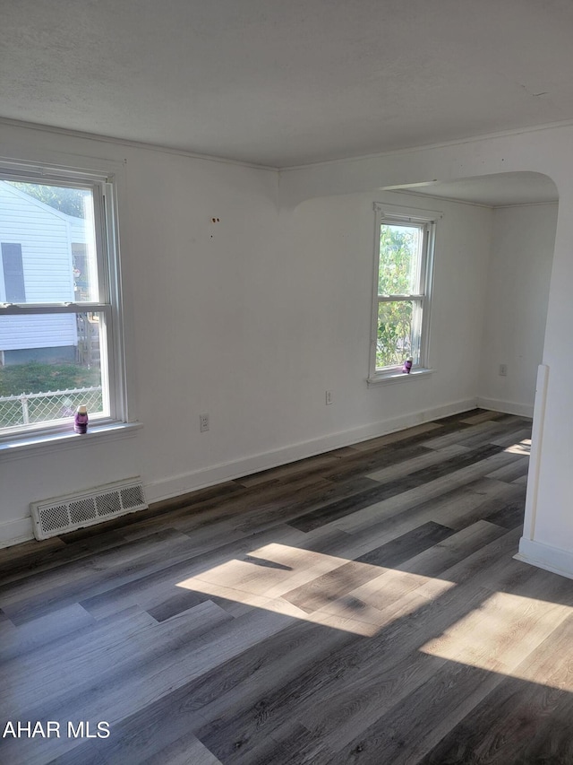 spare room featuring dark hardwood / wood-style flooring