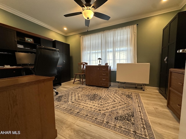 office featuring light wood-type flooring, a ceiling fan, recessed lighting, and ornamental molding