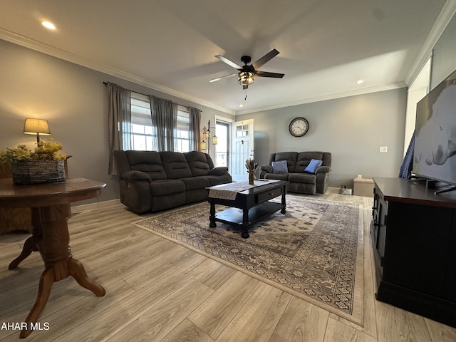 living room featuring recessed lighting, ceiling fan, ornamental molding, and light wood-style floors