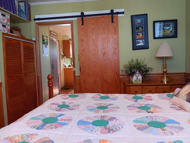 bedroom with a closet and a barn door