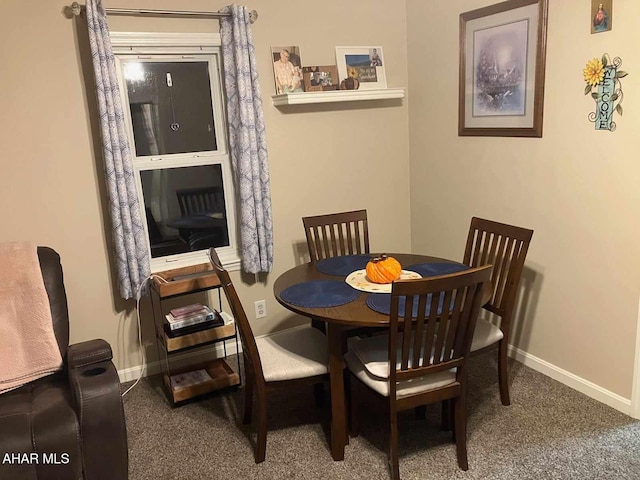 view of carpeted dining area