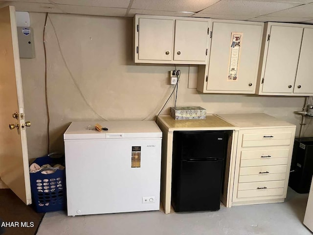 laundry room featuring cabinets