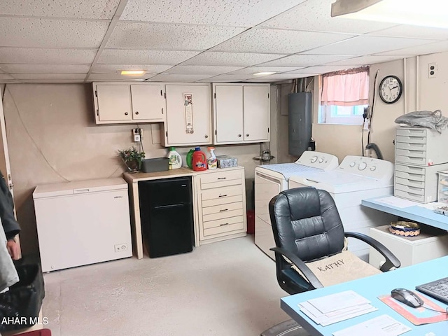 laundry area featuring electric panel, cabinet space, and washing machine and dryer