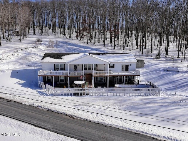 view of front facade with a wooden deck