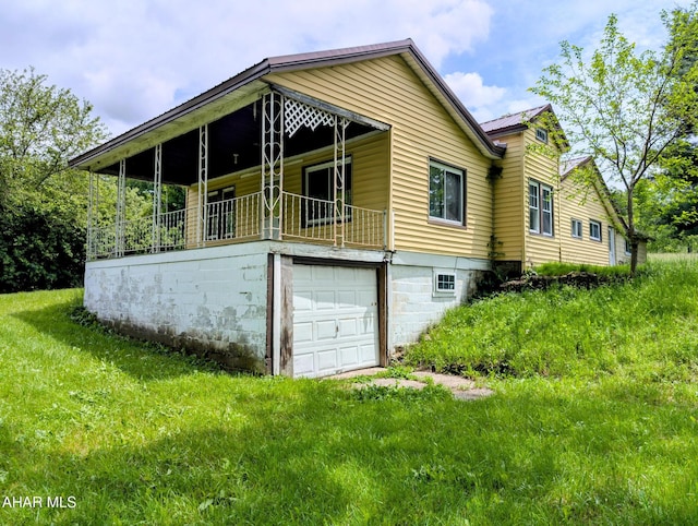 157 Cove Rd, Buffalo Mills, PA 15534 - view of side of home featuring an attached garage and a metal roof