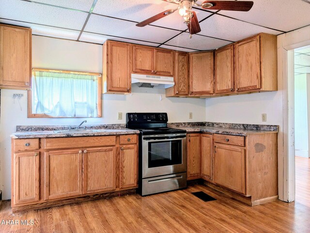 157 Cove Rd, Buffalo Mills, PA 15534 - kitchen featuring electric stove, under cabinet range hood, a paneled ceiling, light wood-style flooring, and brown cabinets