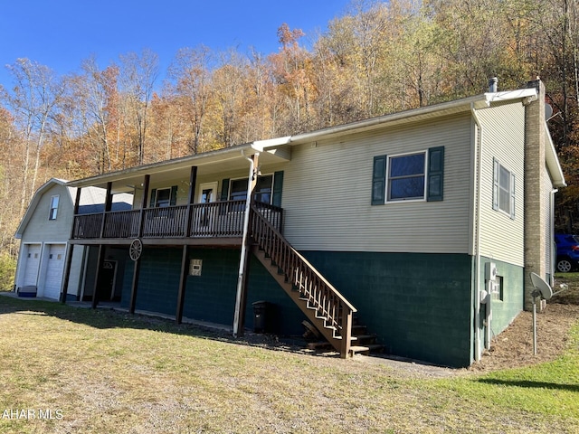 view of front of property with a front lawn and a garage