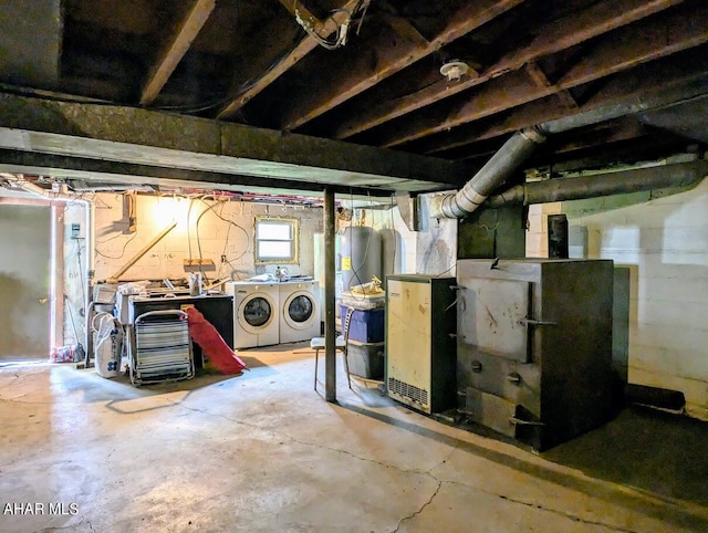 basement featuring washing machine and clothes dryer