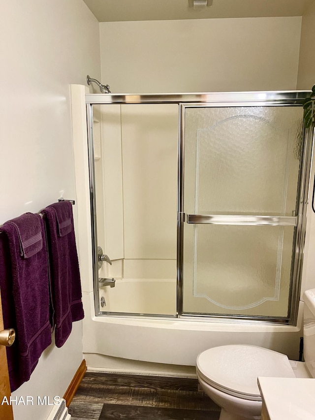 508 Oakwood Dr, Bedford, PA 15522 - bathroom featuring toilet, wood finished floors, enclosed tub / shower combo, and vanity