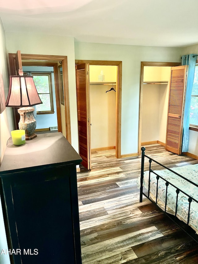 508 Oakwood Dr, Bedford, PA 15522 - bedroom with wood finished floors, baseboards, and two closets