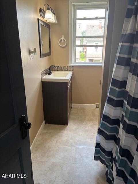 215 N 10th Ave, Altoona, PA 16601 - bathroom featuring vanity and tile patterned floors