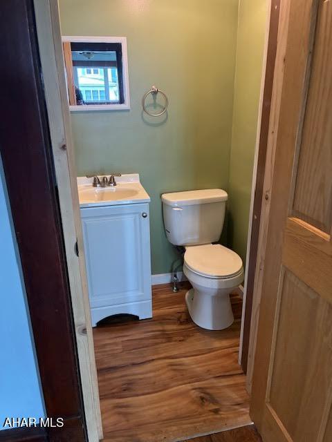 215 N 10th Ave, Altoona, PA 16601 - bathroom featuring vanity and wood finished floors