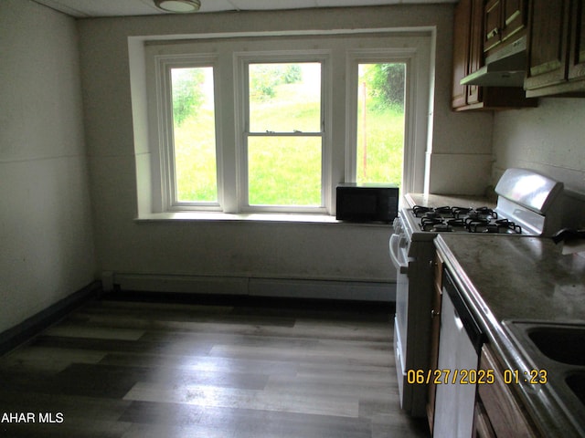 1008 21st Ave, Altoona, PA 16601 - kitchen with range with gas stovetop, under cabinet range hood, black microwave, and plenty of natural light