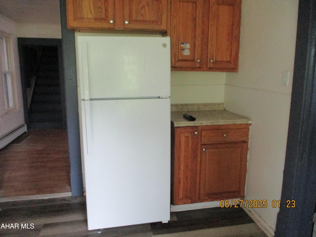 1008 21st Ave, Altoona, PA 16601 - kitchen featuring freestanding refrigerator, wood finished floors, brown cabinets, and light countertops