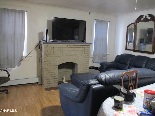 1008 21st Ave, Altoona, PA 16601 - living area featuring a baseboard heating unit and wood finished floors