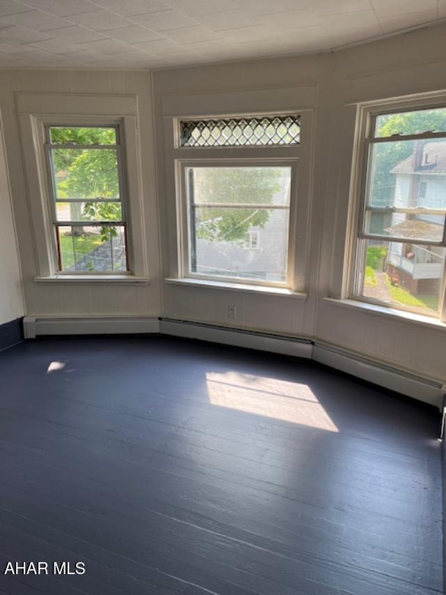 1008 21st Ave, Altoona, PA 16601 - spare room featuring healthy amount of natural light and dark wood finished floors