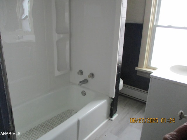 1008 21st Ave, Altoona, PA 16601 - bathroom with a baseboard heating unit, vanity, plenty of natural light, and shower / bathtub combination