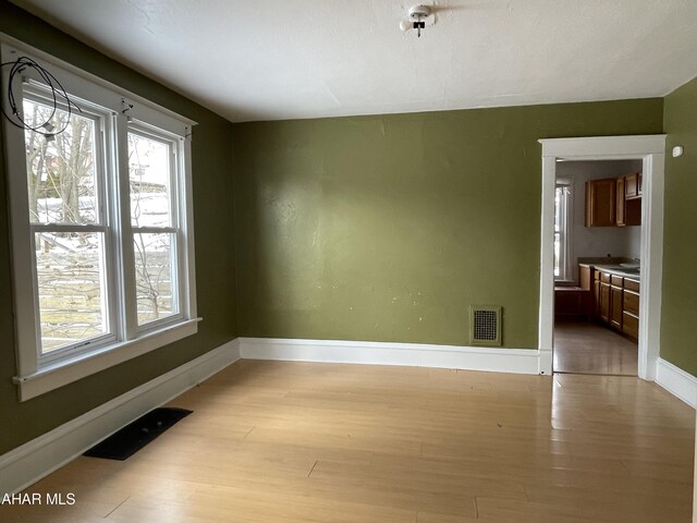 empty room with light wood-type flooring