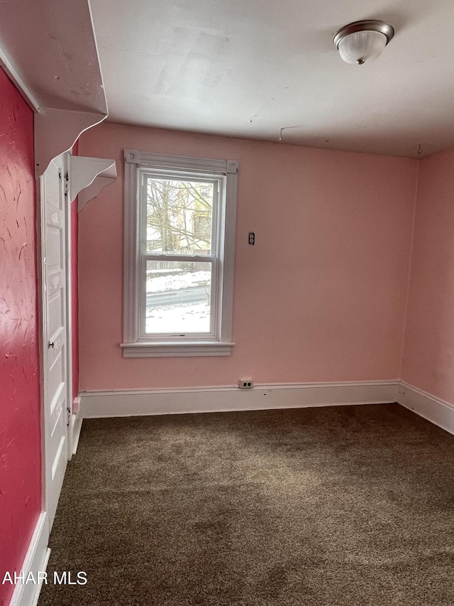 empty room with carpet flooring