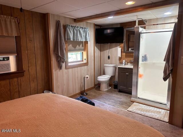 5168 Black Log Rd, Orbisonia, PA 17243 - bathroom featuring toilet, wood walls, vanity, wood finished floors, and baseboards
