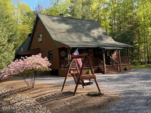 5168 Black Log Rd, Orbisonia, PA 17243 - view of front of house featuring roof with shingles and a porch