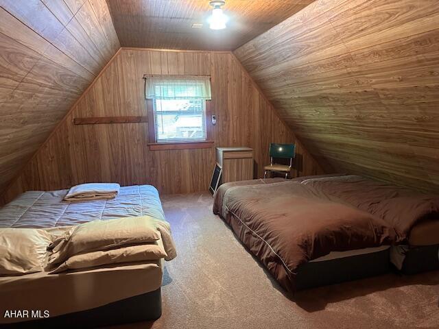 5168 Black Log Rd, Orbisonia, PA 17243 - bedroom featuring carpet, wooden walls, and lofted ceiling