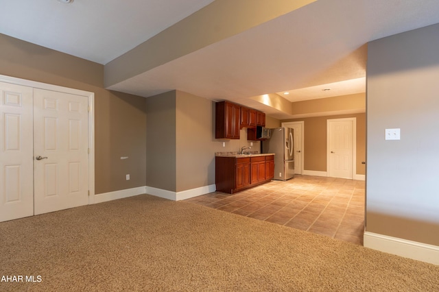 738 Chapel Dr, Altoona, PA 16602 - kitchen featuring light countertops, freestanding refrigerator, light carpet, a sink, and baseboards