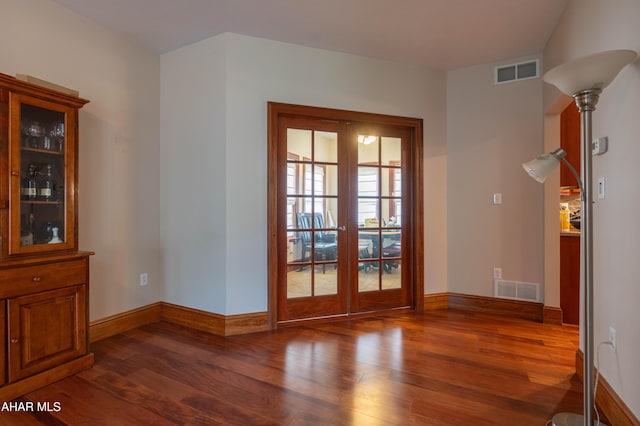 738 Chapel Dr, Altoona, PA 16602 - entryway featuring french doors, wood finished floors, and baseboards