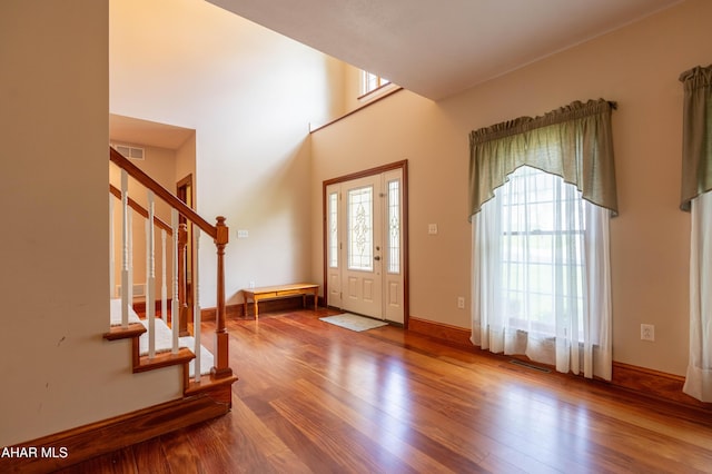 738 Chapel Dr, Altoona, PA 16602 - entryway with wood finished floors, stairway, baseboards, and a towering ceiling
