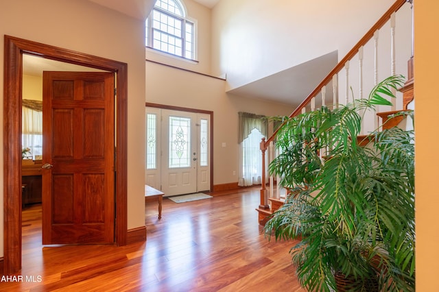 738 Chapel Dr, Altoona, PA 16602 - entryway featuring plenty of natural light, stairs, light wood-style floors, a towering ceiling, and baseboards