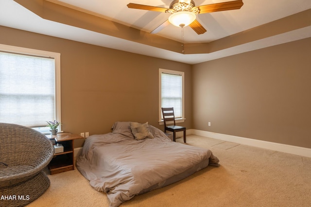 738 Chapel Dr, Altoona, PA 16602 - bedroom with light carpet, baseboards, a raised ceiling, and ceiling fan
