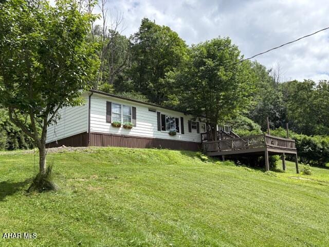 130 E 7th St, Coudersport, PA 16915 - view of front facade featuring a deck and a front lawn