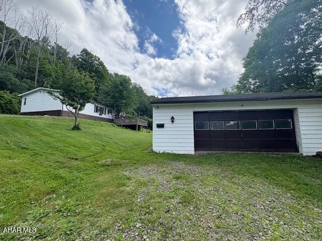 130 E 7th St, Coudersport, PA 16915 - view of green lawn with a garage