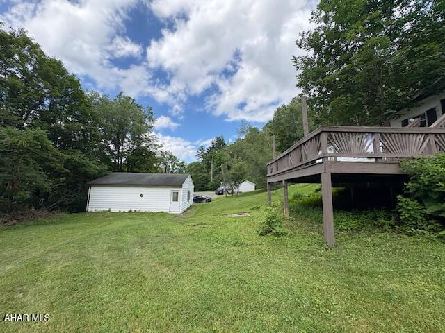 130 E 7th St, Coudersport, PA 16915 - view of green lawn featuring a deck
