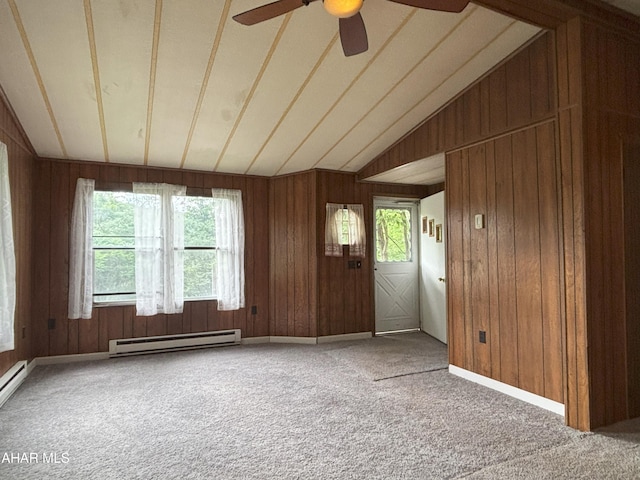 130 E 7th St, Coudersport, PA 16915 - entryway with a baseboard radiator, ceiling fan, carpet flooring, lofted ceiling, and wood walls