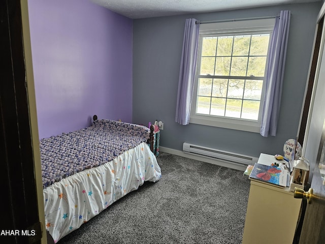 bedroom featuring carpet, a textured ceiling, and a baseboard heating unit