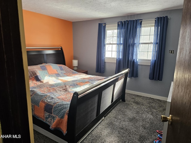 carpeted bedroom featuring a textured ceiling