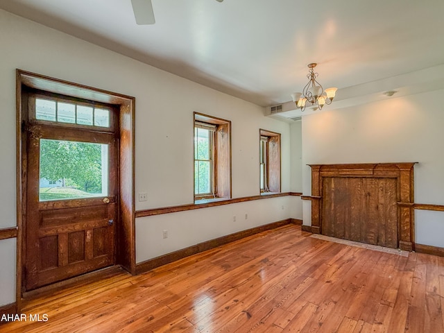 346 Lower Snake Spring Rd, Everett, PA 15537 - foyer entrance featuring a chandelier, light wood-style floors, and ceiling fan