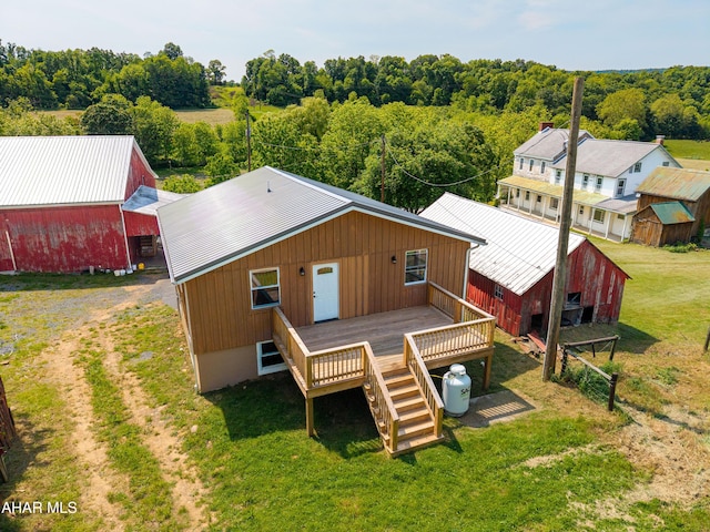 346 Lower Snake Spring Rd, Everett, PA 15537 - back of house featuring an outbuilding, a metal roof, a lawn, a deck, and dirt driveway