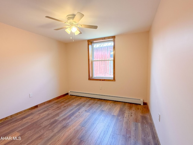 346 Lower Snake Spring Rd, Everett, PA 15537 - spare room featuring a baseboard radiator, wood finished floors, and ceiling fan